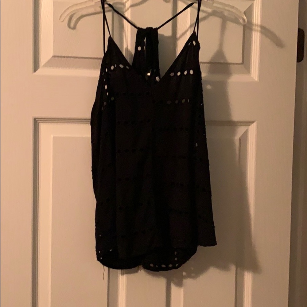 Black tank with holes and flower pattern
